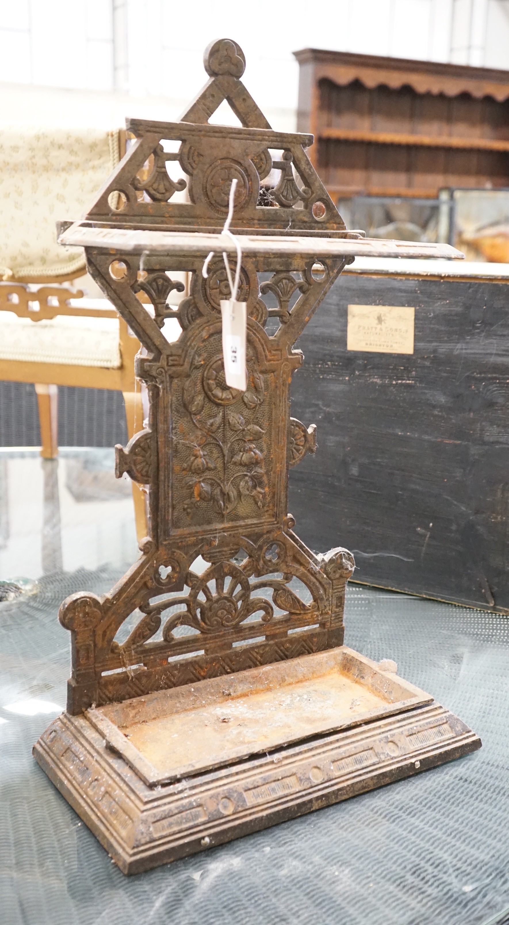 A late Victorian aesthetic movement cast-iron stickstand, width 40cm, depth 22cm, height 69cm